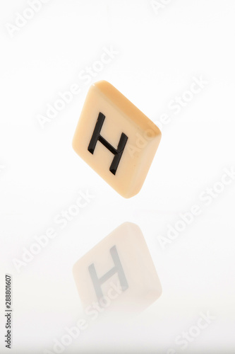 Alphabet H word block with white background.