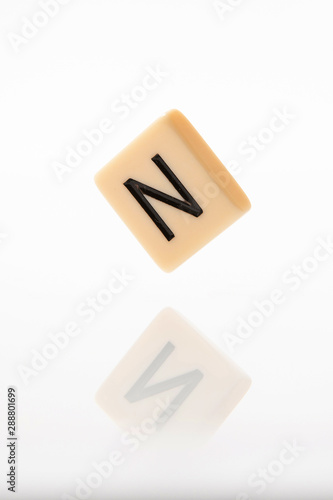 Alphabet N word block with white background.