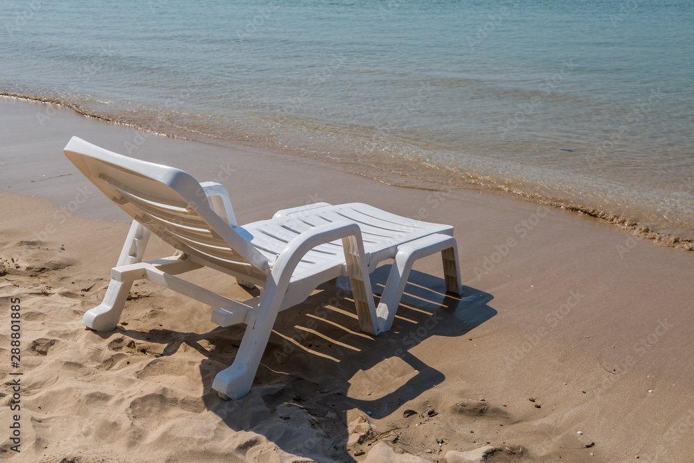 Beach chair at sunny coast at the beach Beach chair at sunny coast at the beach