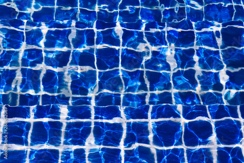 Blue color water in swimming pool rippled