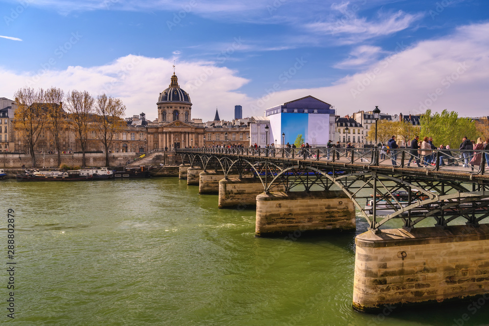 Paris France city skyline at Pont des Arts Bridge and Seine River