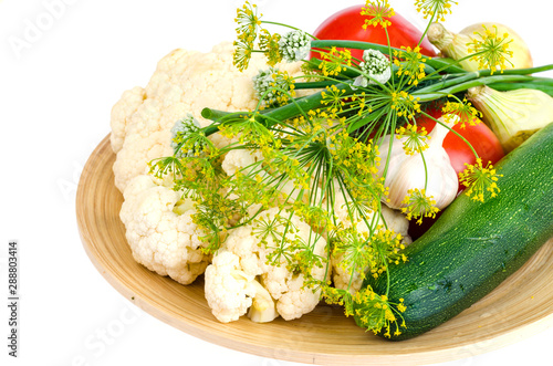 Homemade organic seasonal vegetables on wooden plate