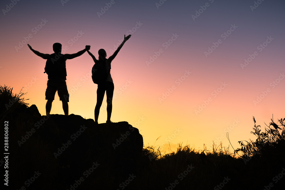 Mountain climbers celebrating reach top of mountain. 