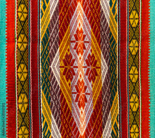 Colourful native indigenous Andes textiles on a local art and craft market of Cusco, Peru. These fabrics can be found in Peru, Ecuador and Bolivia.