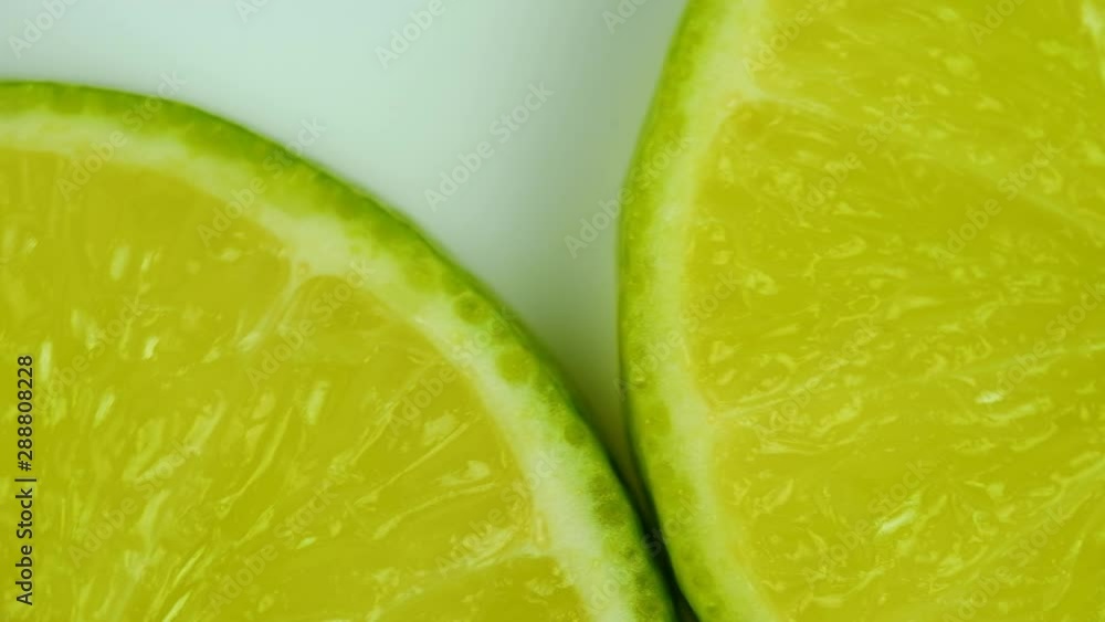green lemons slice on white background. green lemons slice on white background.