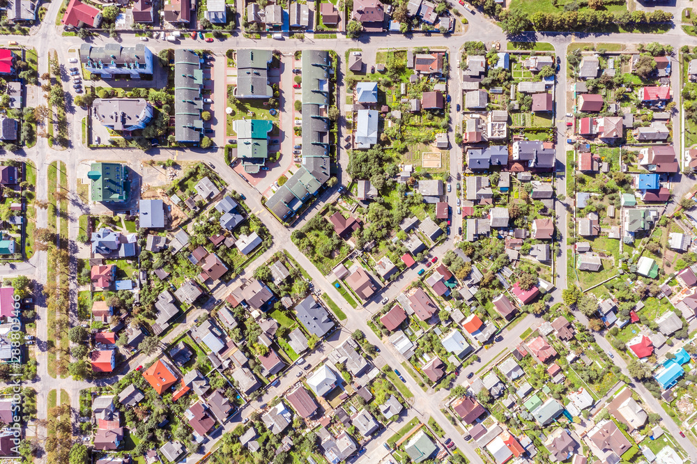 aerial view from the drone of urban houses and streets in a residential area