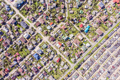 aerial view of a suburban residential neighborhood on a sunny summer day