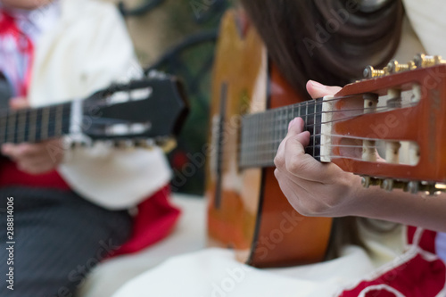 detalle de una guitarra, tocando cueca para fiestas patrias  photo
