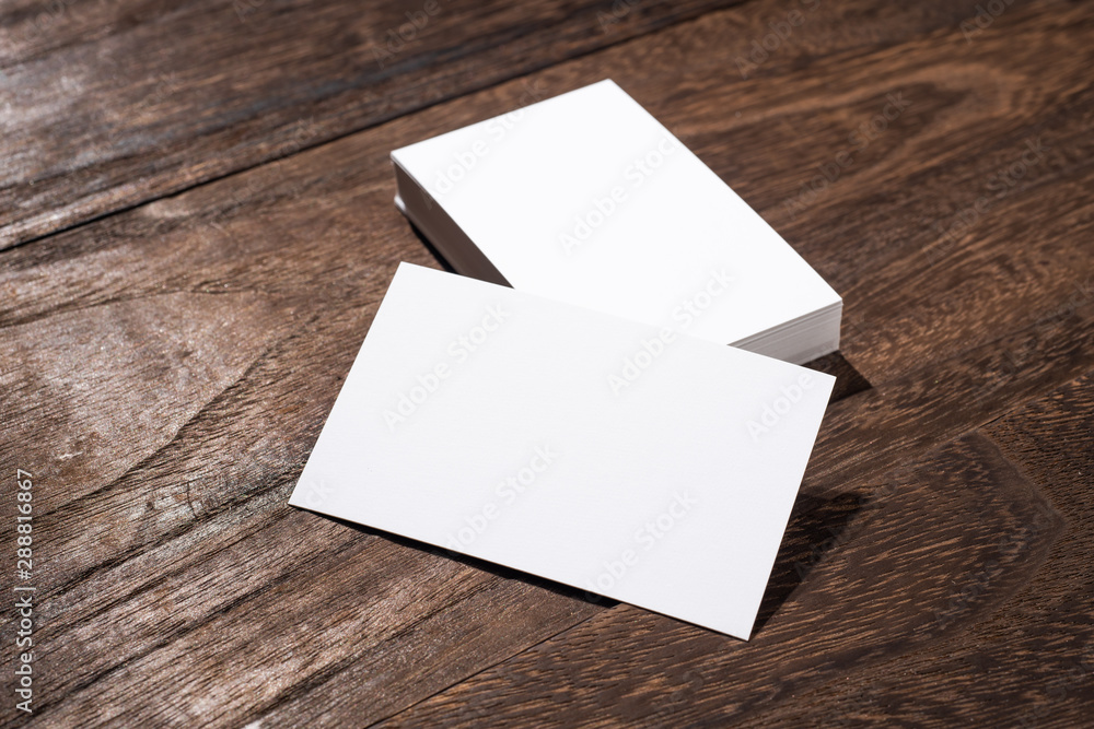 perspective view of business card on wood floor perspective view of business card on wood floor