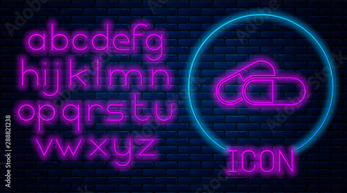 Glowing neon Medicine pill or tablet icon isolated on brick wall background. Capsule pill and drug sign. Pharmacy design. Neon light alphabet. Vector Illustration