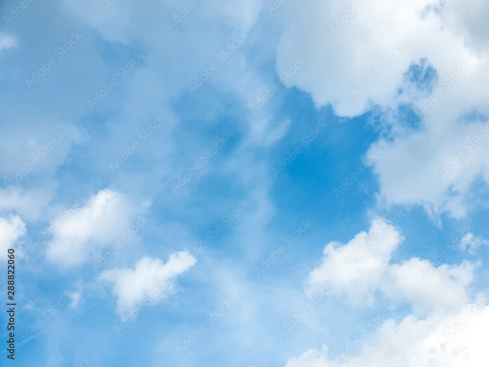 Big cloud floating in blue sky with copy space. Water droplets and ice crystals gathered together into clumps. Floating in the azure atmosphere Big cloud floating in blue sky with copy space. Water droplets and ice crystals gathered together into clumps. Floating in the azure atmosphere
