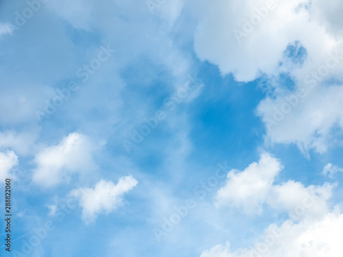 Big cloud floating in blue sky with copy space. Water droplets and ice crystals gathered together into clumps. Floating in the azure atmosphere