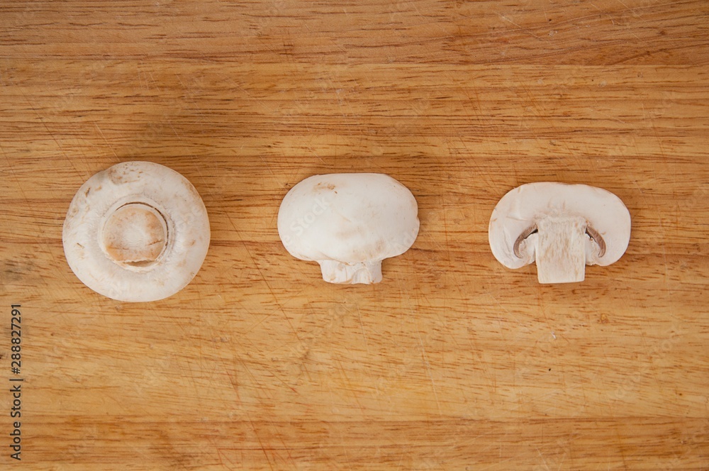 fresh mushrooms on a chopping board fresh mushrooms on a chopping board