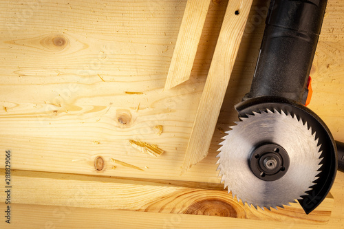 Circular saw on the wooden table. Contractor handiman worker concept. photo