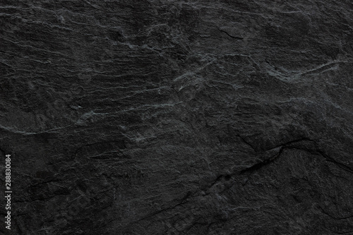 Dark grey black slate background or texture. black stone photo