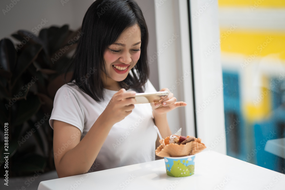Asian young beautiful talking picture of a dessert Asian young beautiful talking picture of a dessert