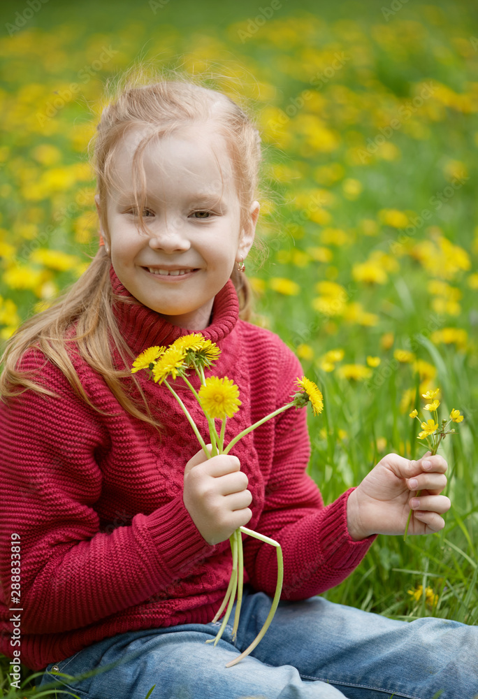 Little girl and meadow with dandelions. Summer day outdoors Little girl and meadow with dandelions. Summer day outdoors