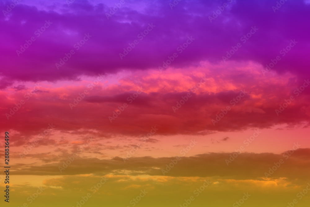 beautiful unreal vivid fantasy sun colored clouds in the sky for using in design as background.