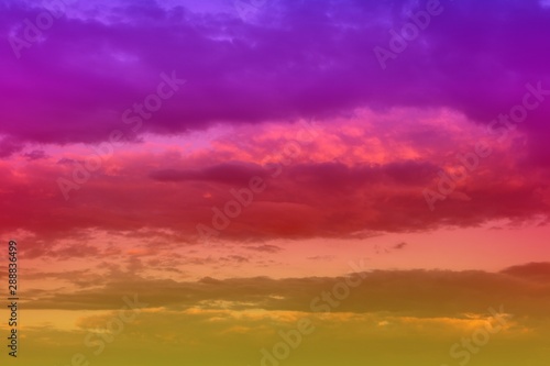 beautiful unreal vivid fantasy sun colored clouds in the sky for using in design as background.