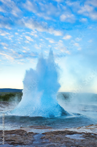 Strokkur Geysir Eruption with Bright Blue Sky, Iceland