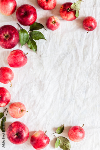 Fototapeta Naklejka Na Ścianę i Meble -  Red Apples on White Fabric