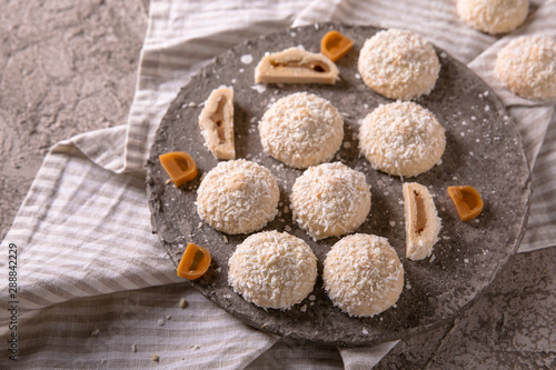 Coconut biscuit with caramel. Crispy and crumbly delicious cookies with natural ingredients: flour, nuts, seeds, pieces of chocolate, cocoa, fruit jams.