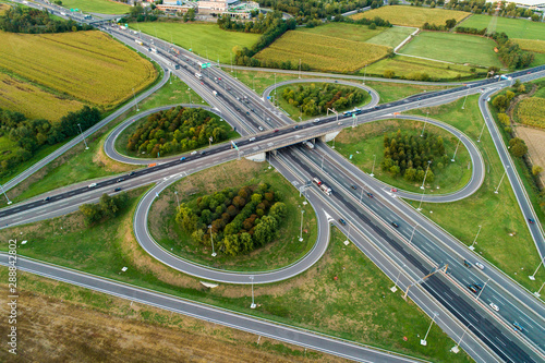 Cloverleaf interchange seen from above. Aerial view of highway road junction in the countryside. Bird's eye view.