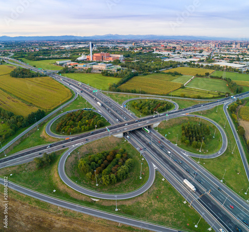 Cloverleaf interchange seen from above. Aerial view of highway road junction in the countryside. Bird's eye view.