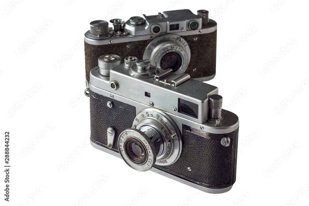 vintage shabby camera on blurred background of another camera isolated on white background