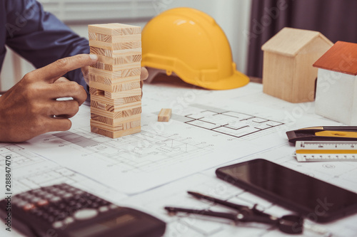 Architect Engineer Working with Blueprints in the office.