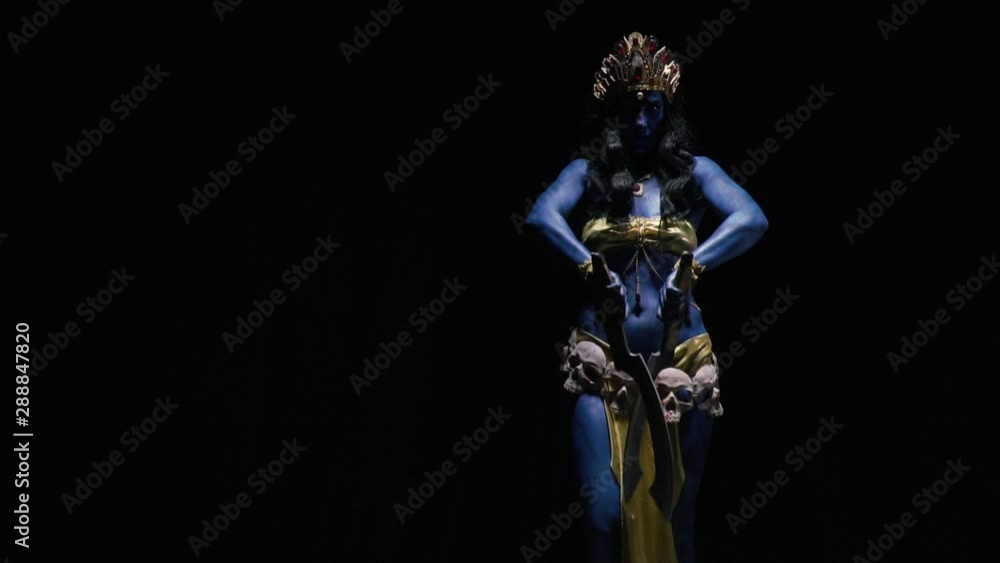 Indian goddess Kali is dancing with the blades on black background Indian goddess Kali is dancing with the blades on black background