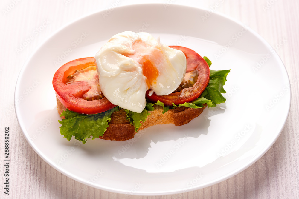 poached egg on a piece of toasted bread