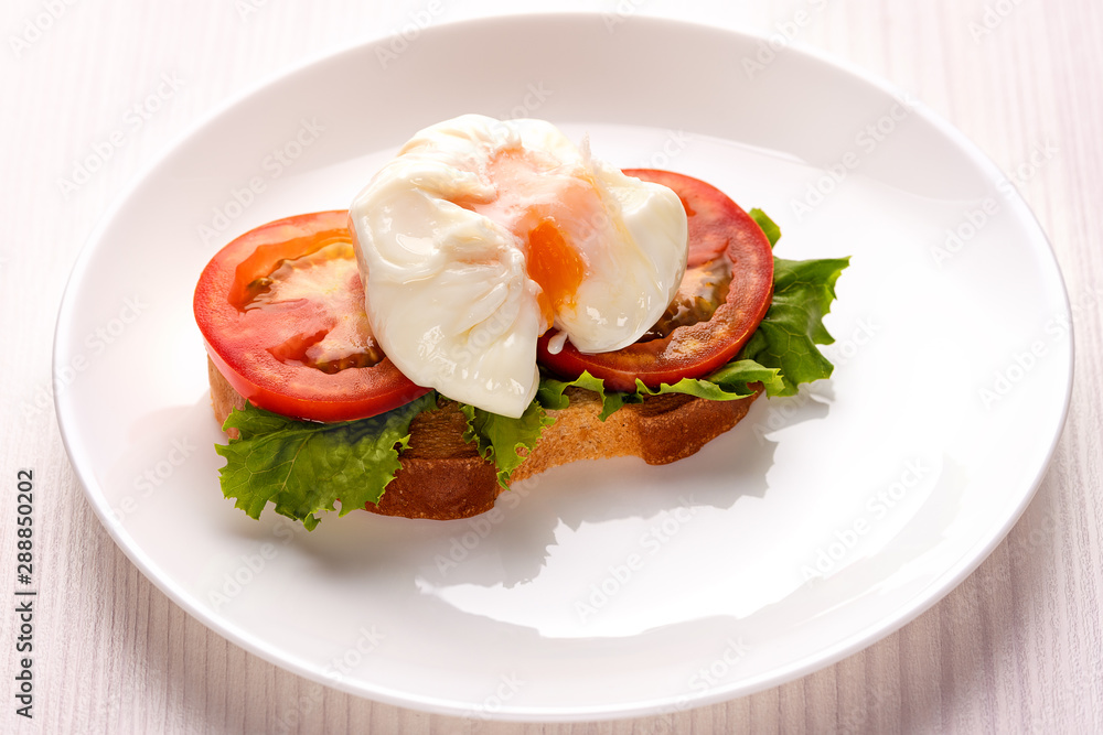 poached egg on a piece of toasted bread poached egg on a piece of toasted bread