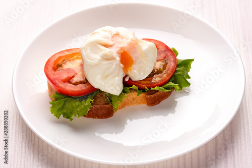 poached egg on a piece of toasted bread