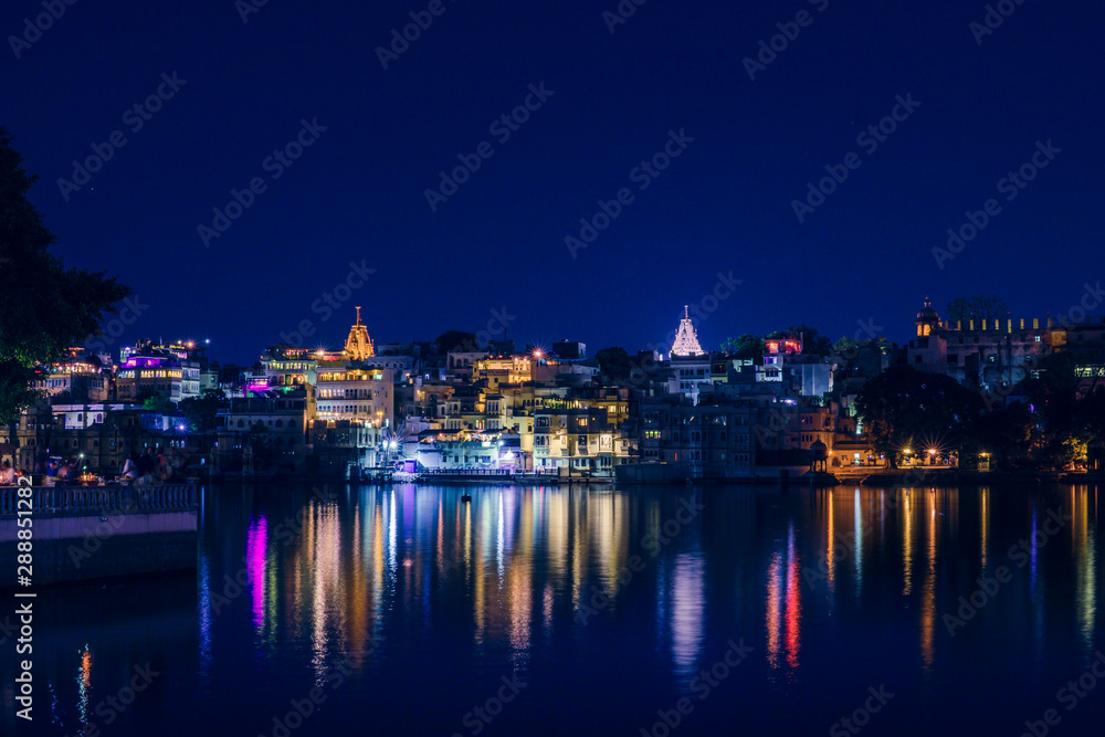 Panoramic night view over Old City at Lake Pichola from Ambrai Ghat at Udaipur, Rajasthan, India