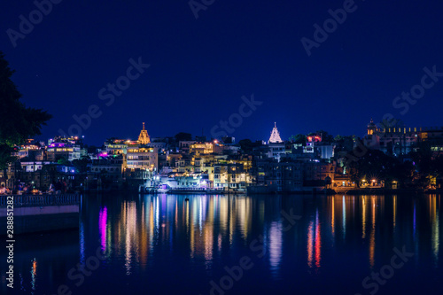 Panoramic night view over Old City at Lake Pichola from Ambrai Ghat at Udaipur, Rajasthan, India