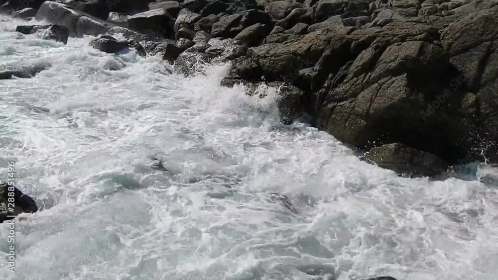 Waves washing over rocks and boulders Waves washing over rocks and boulders