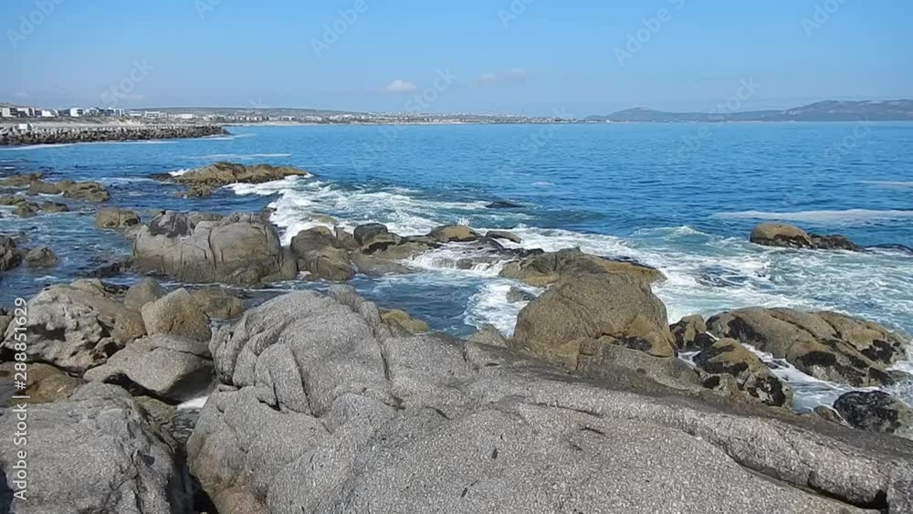 Waves washing over rocks and boulders Waves washing over rocks and boulders