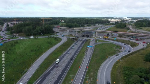 Highway junction bridge flyover infrastructure construction site, aerial view photo