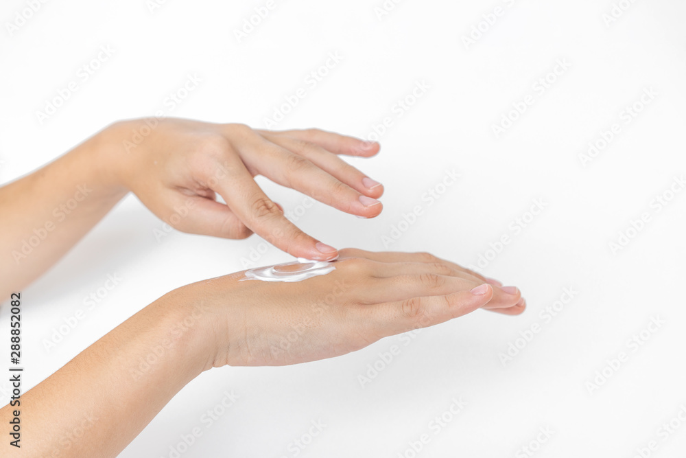 Hand skin care. Closeup on woman's hands applying moisturizing hand cream on. Cream for hands and treatment. Hand skin care. Closeup on woman's hands applying moisturizing hand cream on. Cream for hands and treatment.