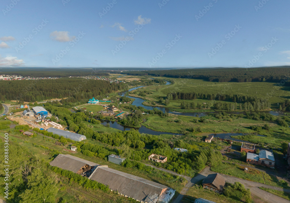 Iset river and Industrial Zone in Aramil village. Aerial, summer, sunny