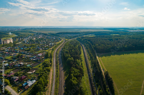 intersecting railways in Aramil village. Aerial, summer, sunny