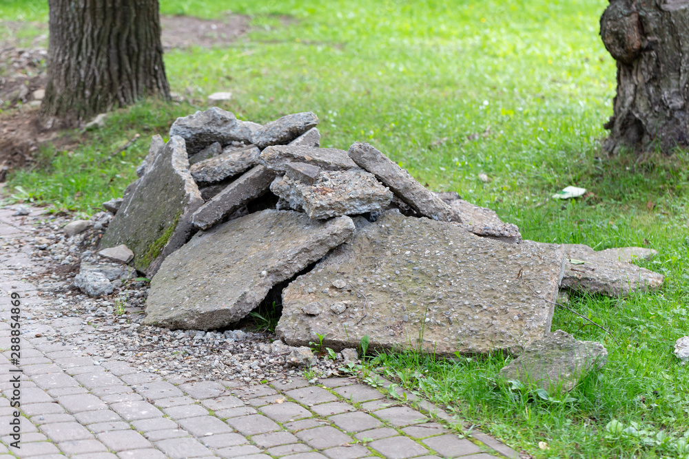 pavement renovation with rubble on the lawn