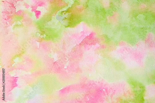 Abstract pink-green watercolor background, bright, contrast splashes, drops, smudges. Artistic background with paper texture.