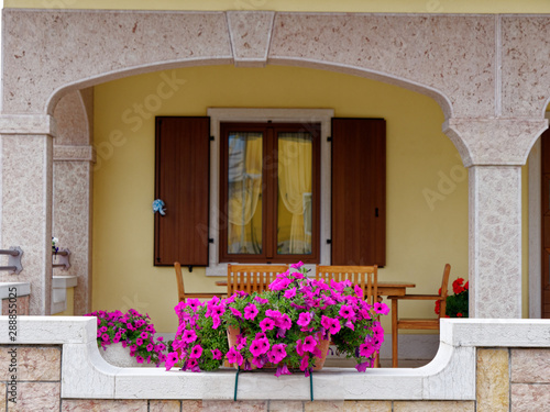 windows and doors of a building in a mountain village of Italy