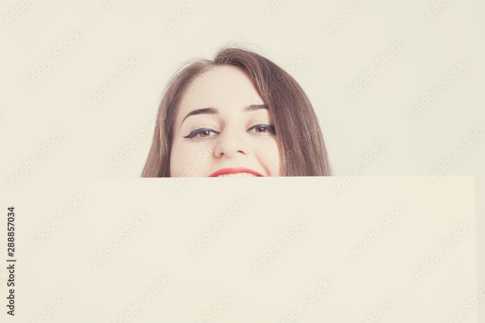 Model plus size with sweet donut, happy surprised girl posing, in black bodysuit. XXL female on light background with white board with space for text Model plus size with sweet donut, happy surprised girl posing, in black bodysuit. XXL female on light background with white board with space for text