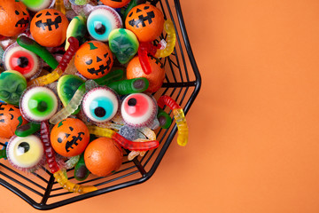 Funny Haloween candy in a spiderweb bowl
