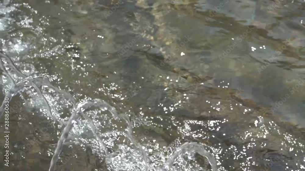 Closeup view of water in city fountain outdoors. Closeup view of water in city fountain outdoors.