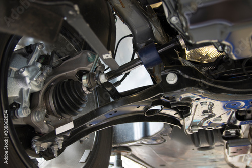 Close-up on the front suspension of a modern car. MacPherson suspension. Technical photography