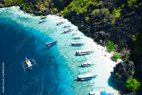 Fototapeta Aerial view of beautiful lagoons and limestone cliffs of El Nido, Palawan, Phili